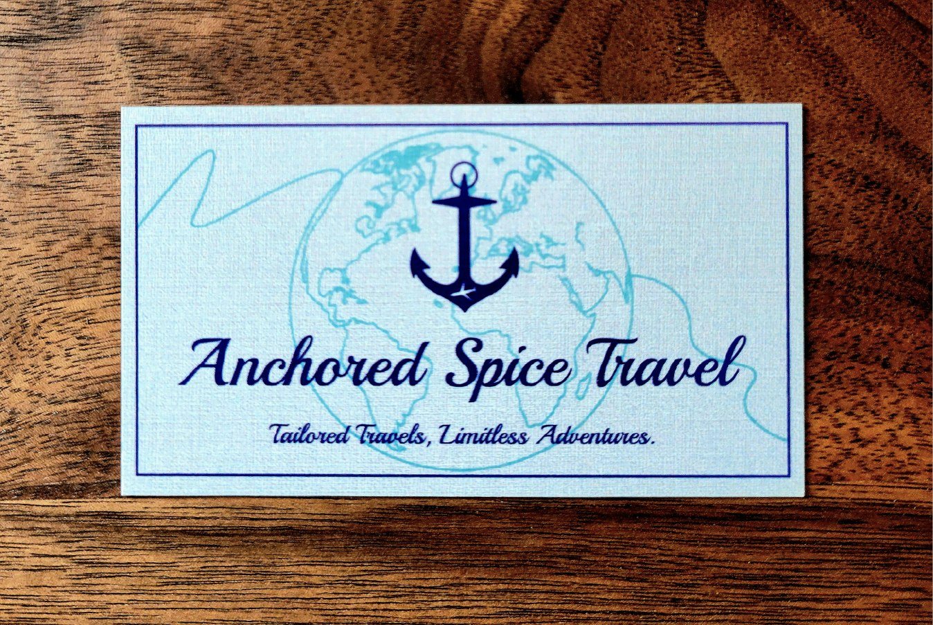Printed Anchored Spice Travel business cards showing the finished brand identity