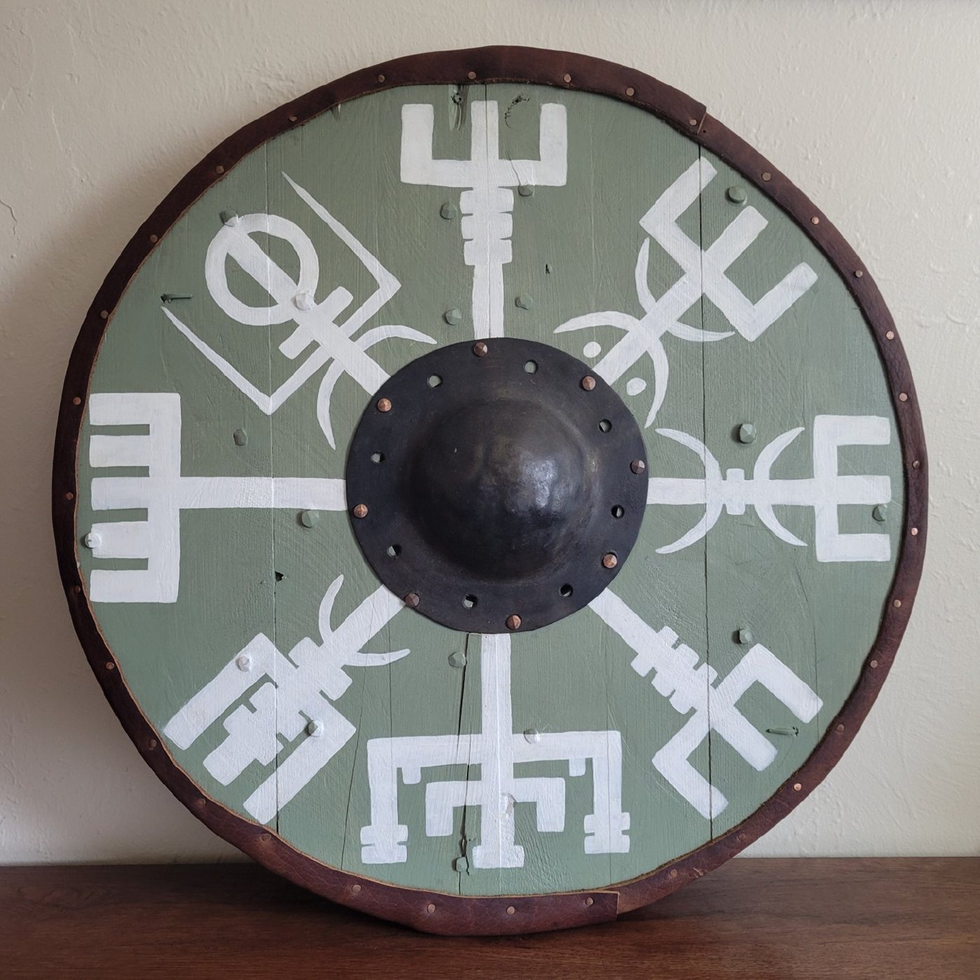 Completed Viking shield hand-painted with a Vegvisir runic compass design
